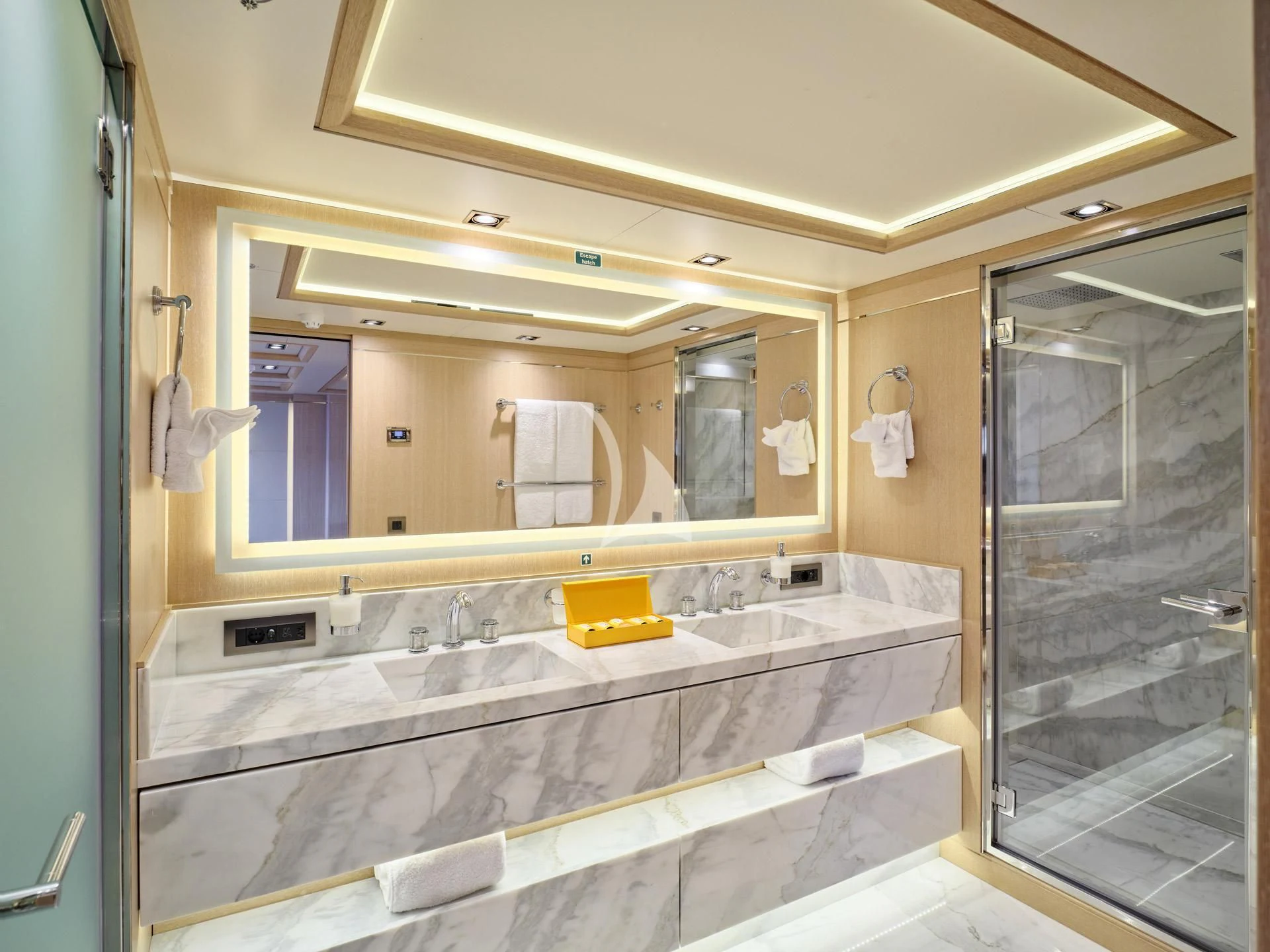 a bathroom with a large mirror aboard JAZ Yacht for Charter