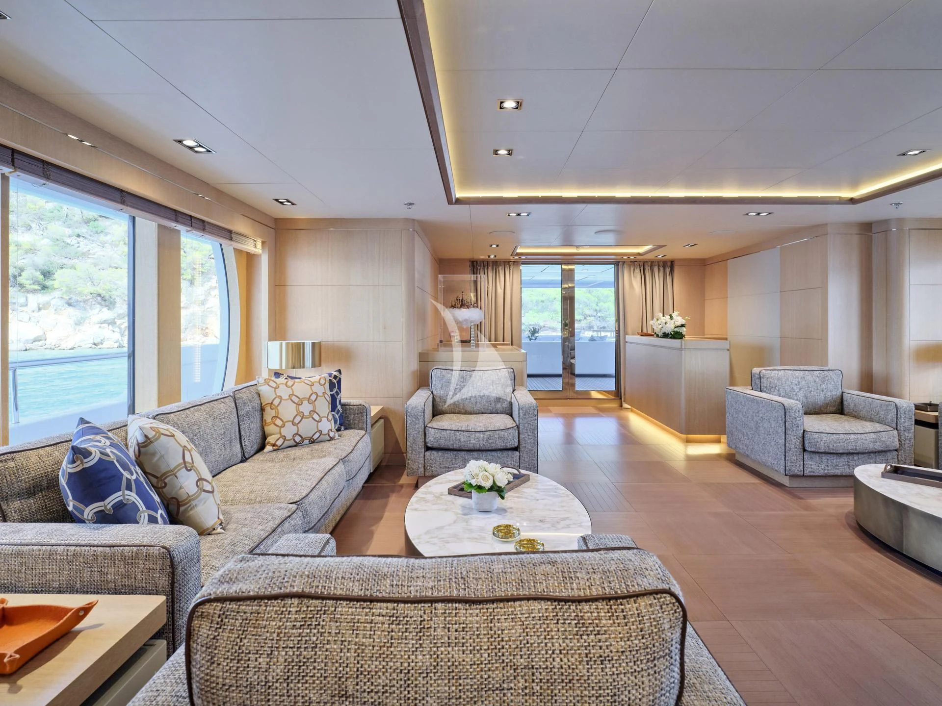 a living room with a couch and a table aboard JAZ Yacht for Charter