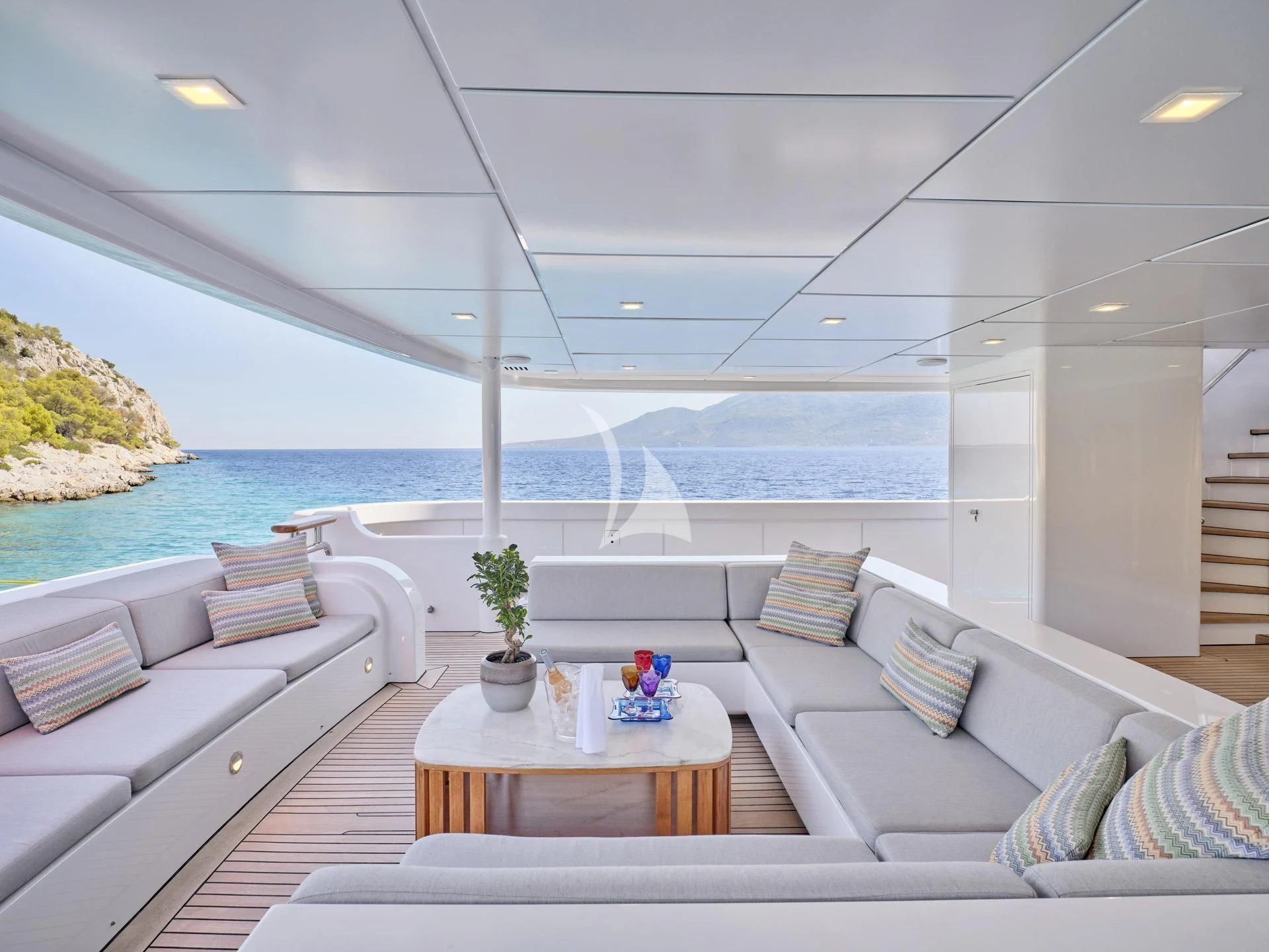 a living room with a large body of water aboard JAZ Yacht for Charter