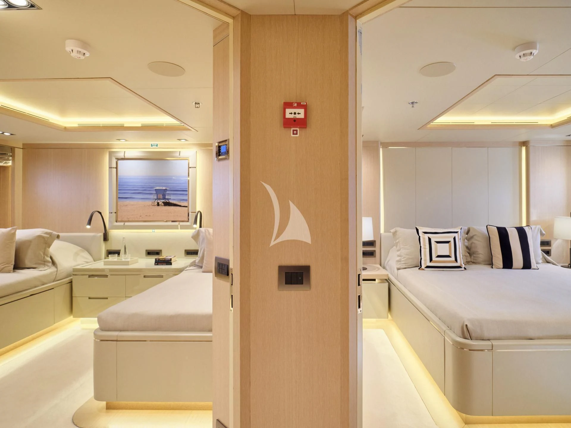 a room with a bed and a mirror aboard JAZ Yacht for Charter