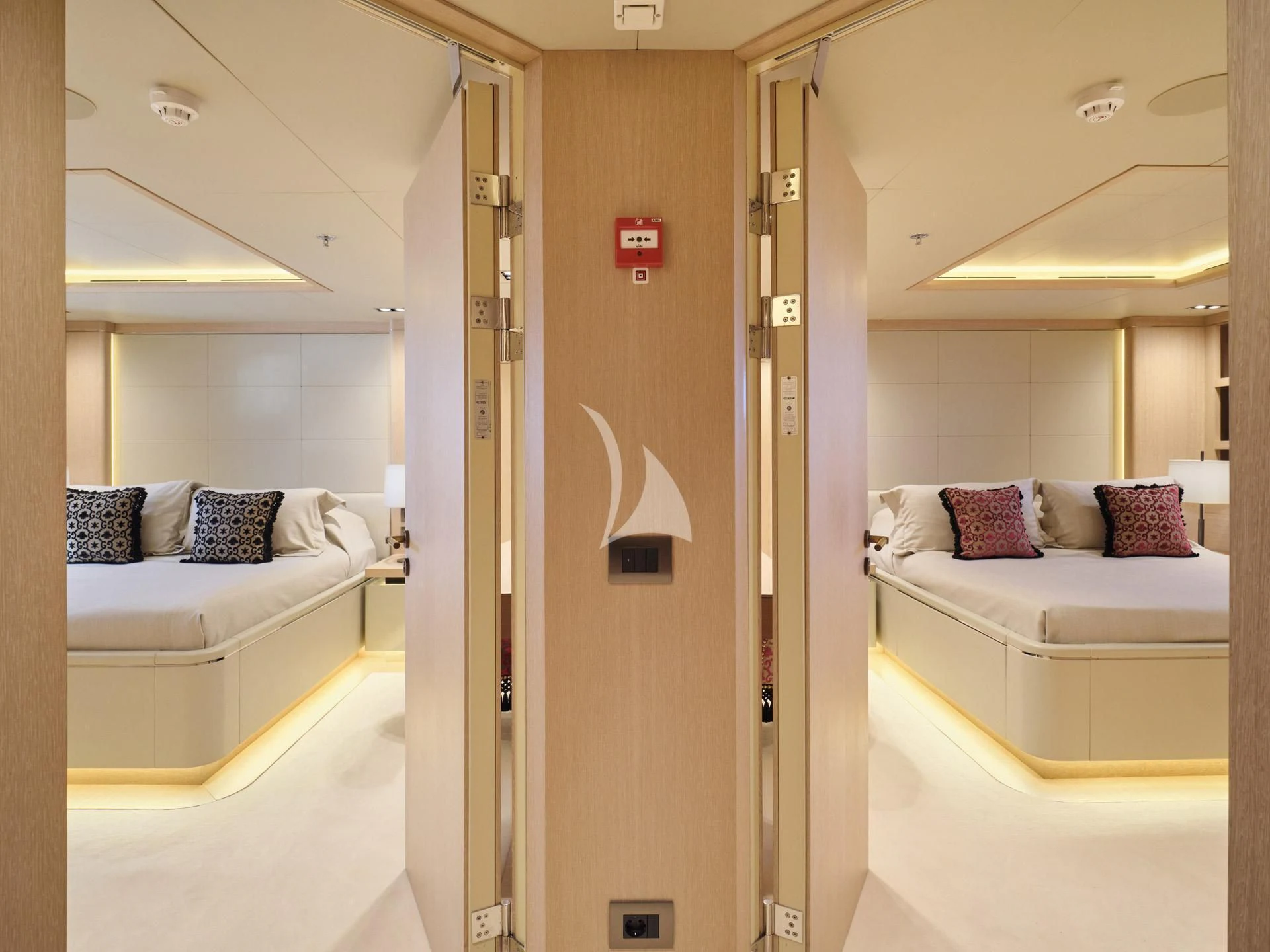 a room with a bed and a door aboard JAZ Yacht for Charter