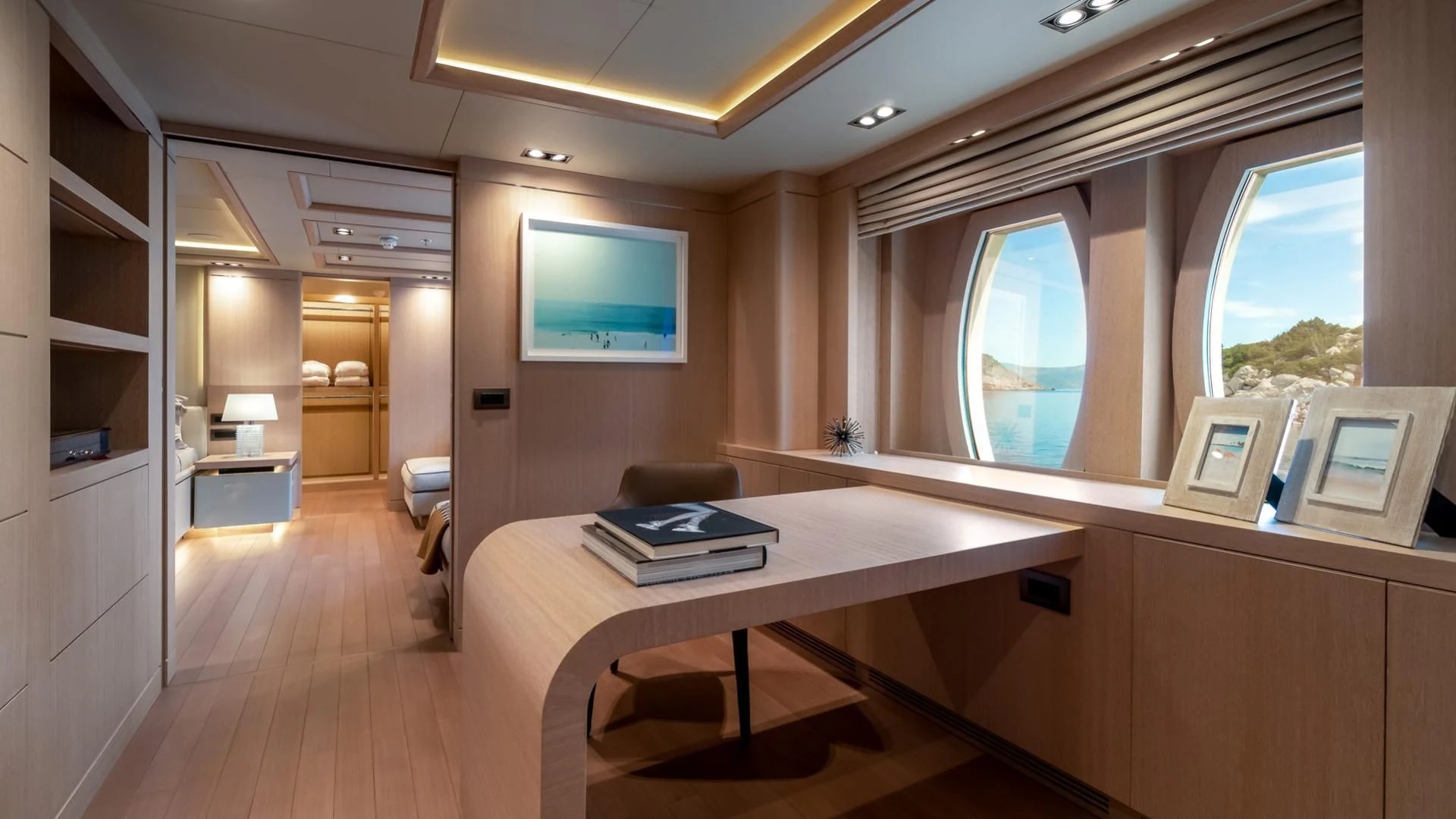 a room with a desk and a window aboard JAZ Yacht for Charter