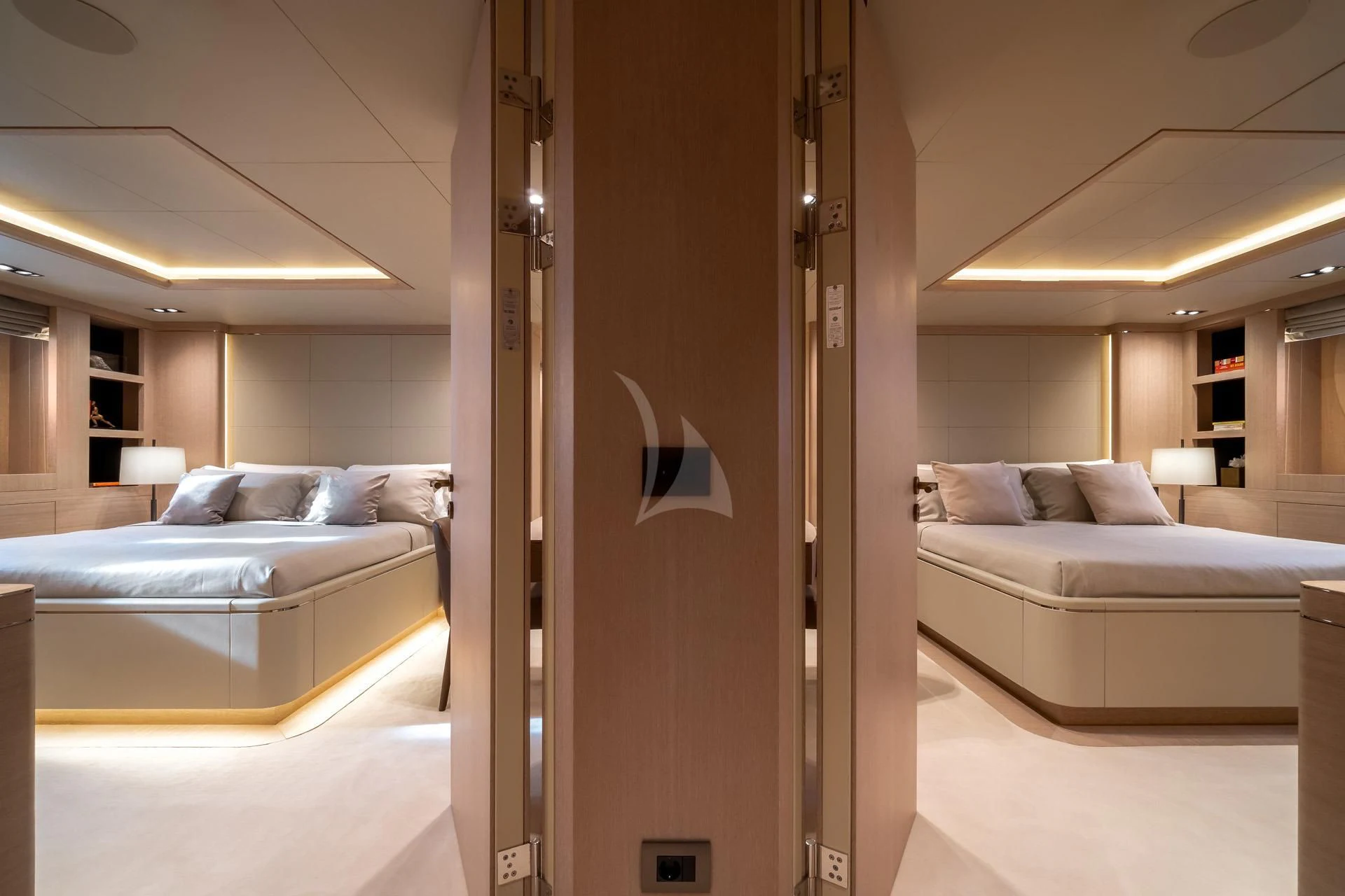 a room with a bed and a couch aboard JAZ Yacht for Charter