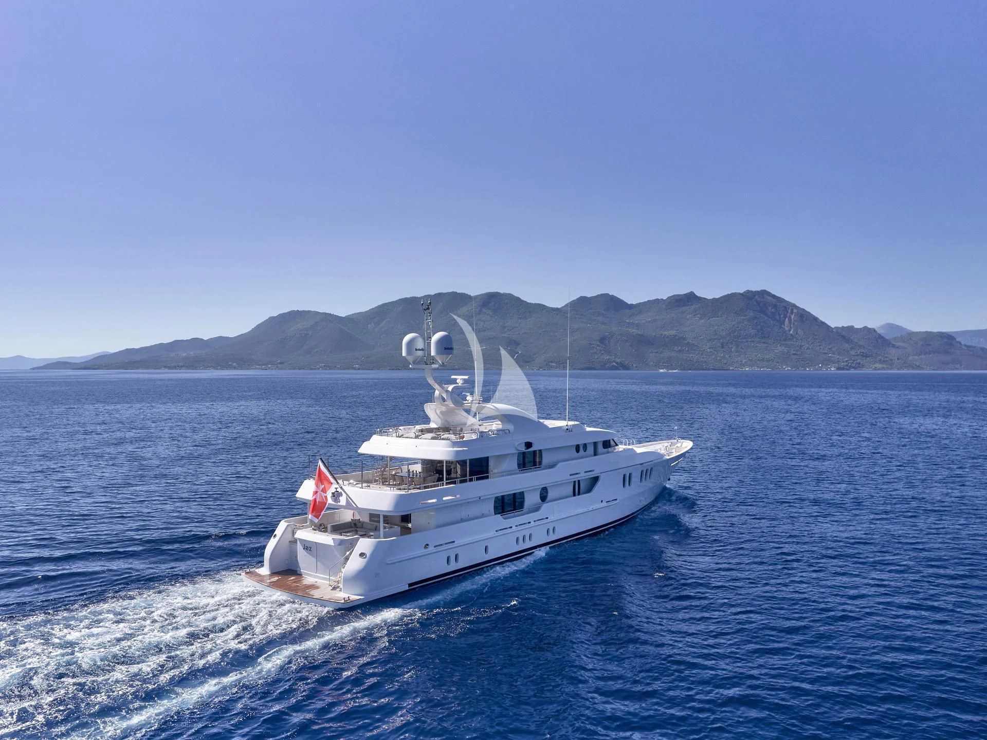 a white boat in the water aboard JAZ Yacht for Charter
