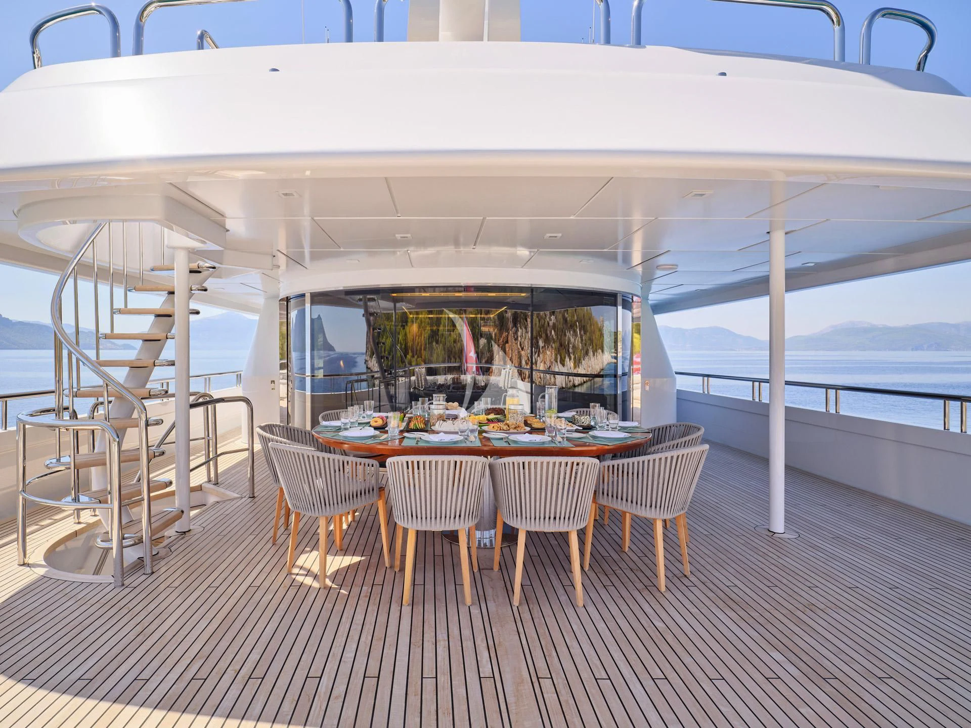 a tent with tables and chairs aboard JAZ Yacht for Charter