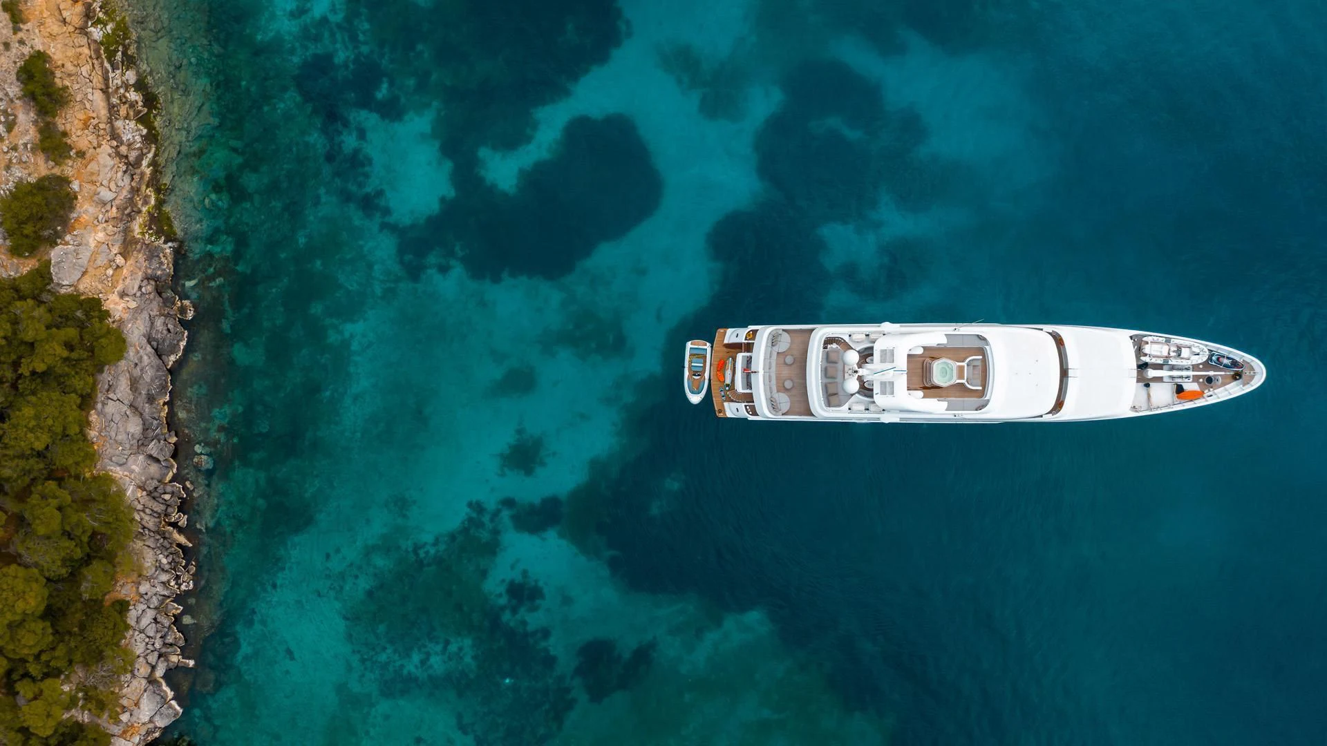 a car in the water aboard JAZ Yacht for Charter