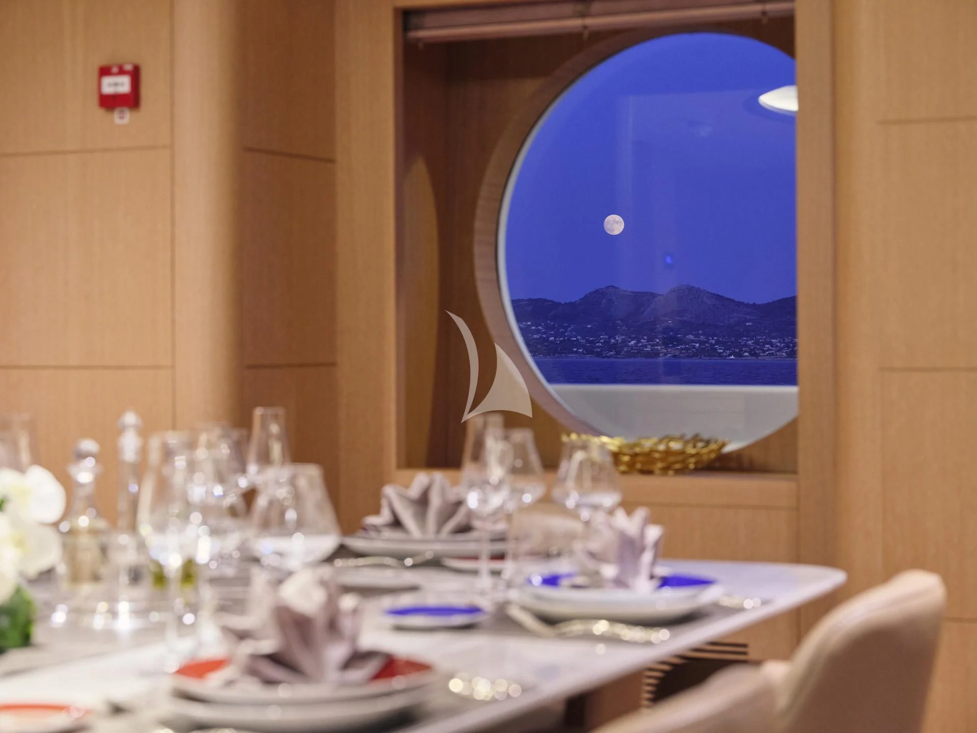 a table with many glasses and plates aboard JAZ Yacht for Charter
