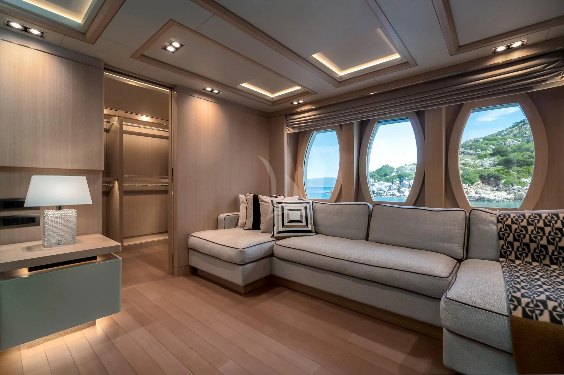 a living room with a couch and a table aboard JAZ Yacht for Charter