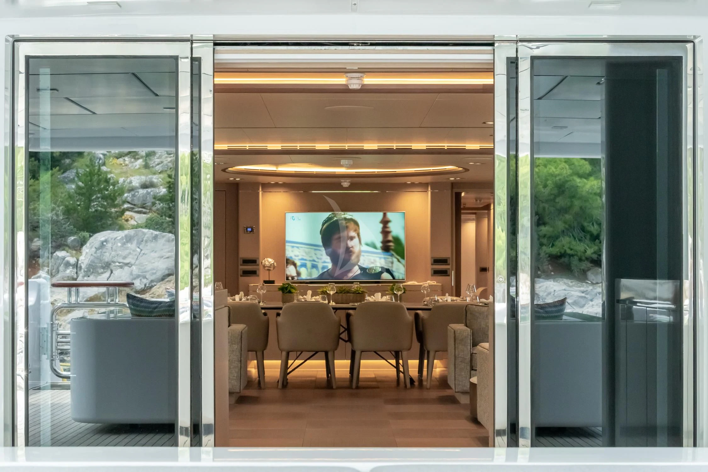 a room with a large screen aboard JAZ Yacht for Charter