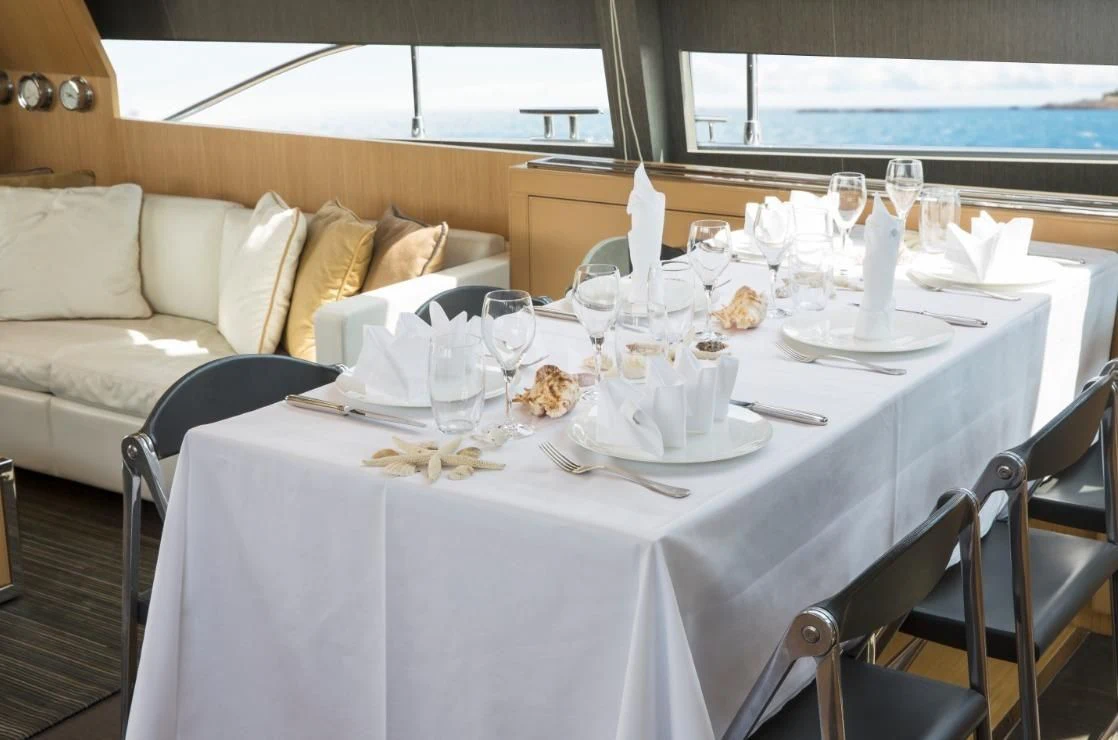 a table set for a dinner aboard WHATEVER Yacht for Sale
