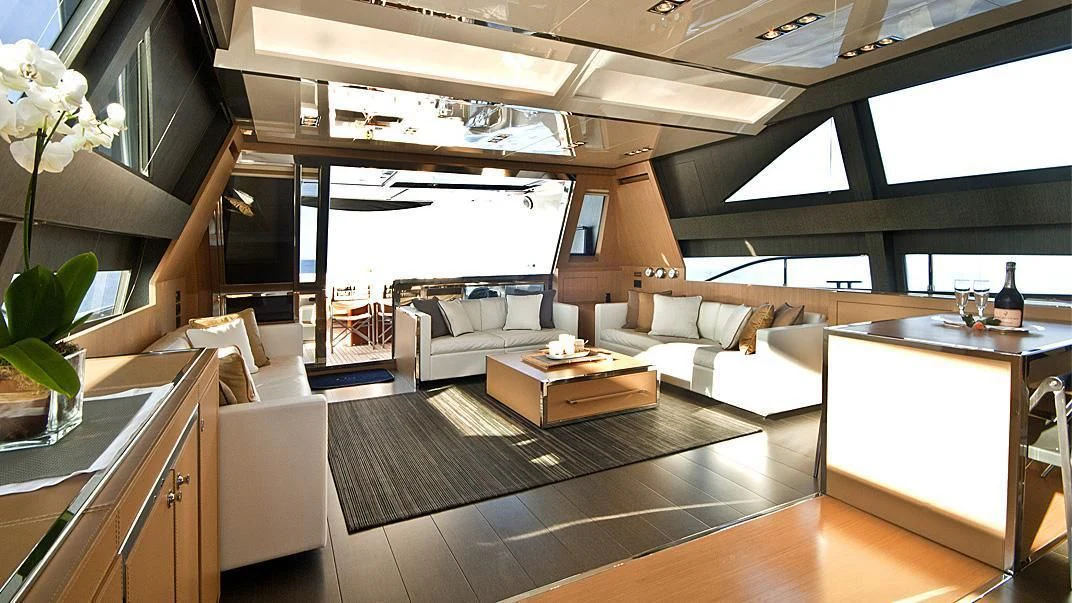 a room with a couch and a table aboard WHATEVER Yacht for Sale