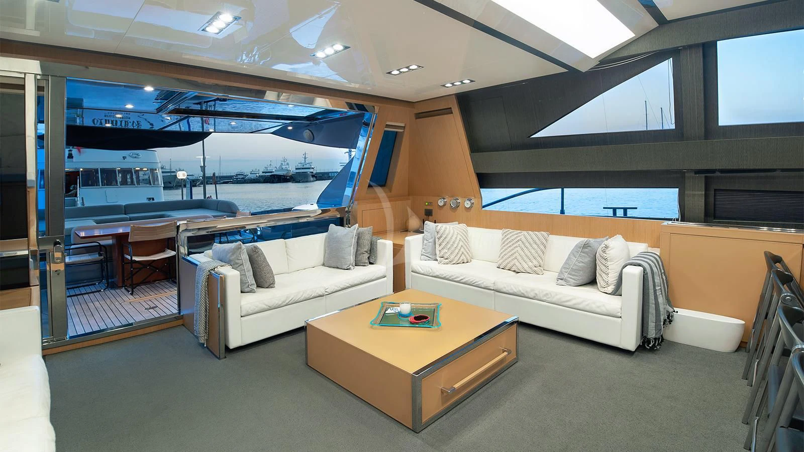 a living room with a couch and a table aboard WHATEVER Yacht for Sale