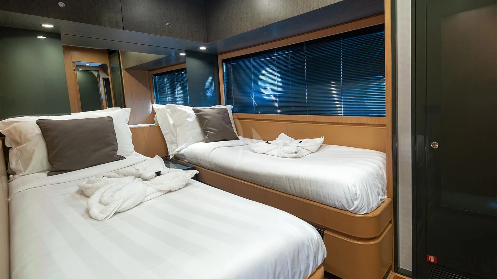 a room with beds and a window aboard WHATEVER Yacht for Sale