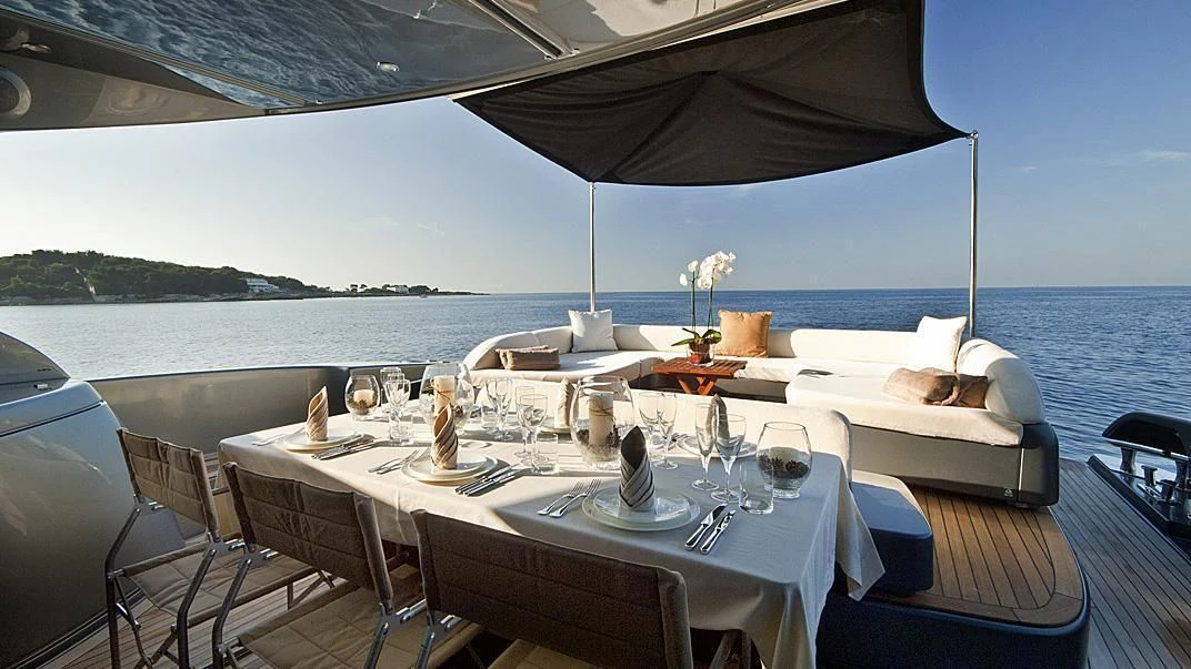 a table set for a meal on a boat aboard WHATEVER Yacht for Sale