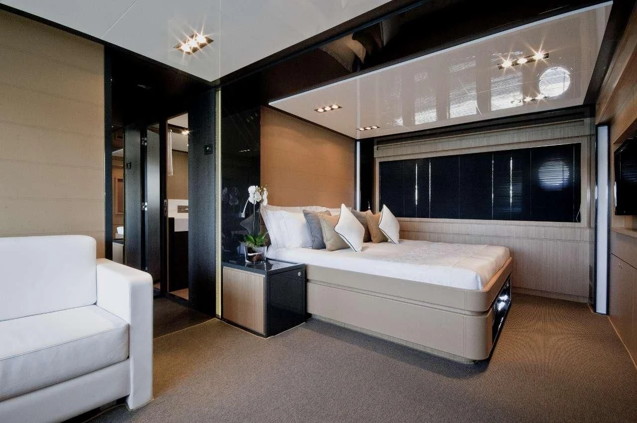 a room with a bed and a couch aboard WHATEVER Yacht for Sale