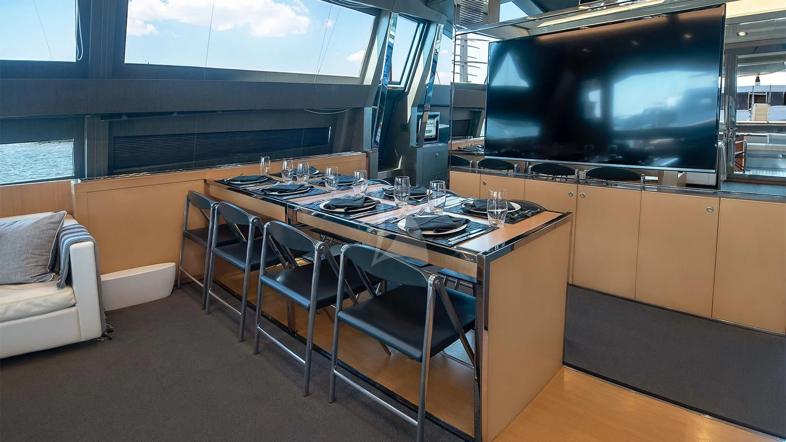 a large kitchen with a bar and bar aboard WHATEVER Yacht for Sale