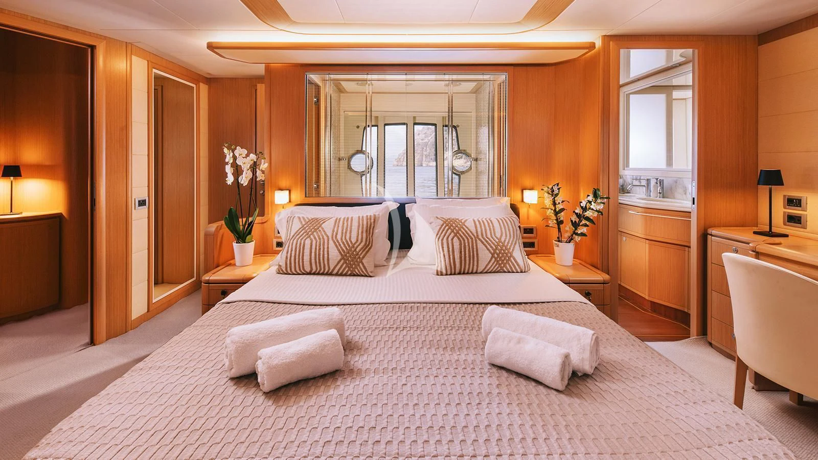 a large bed in a hotel room aboard MAYBE NOT Yacht for Sale