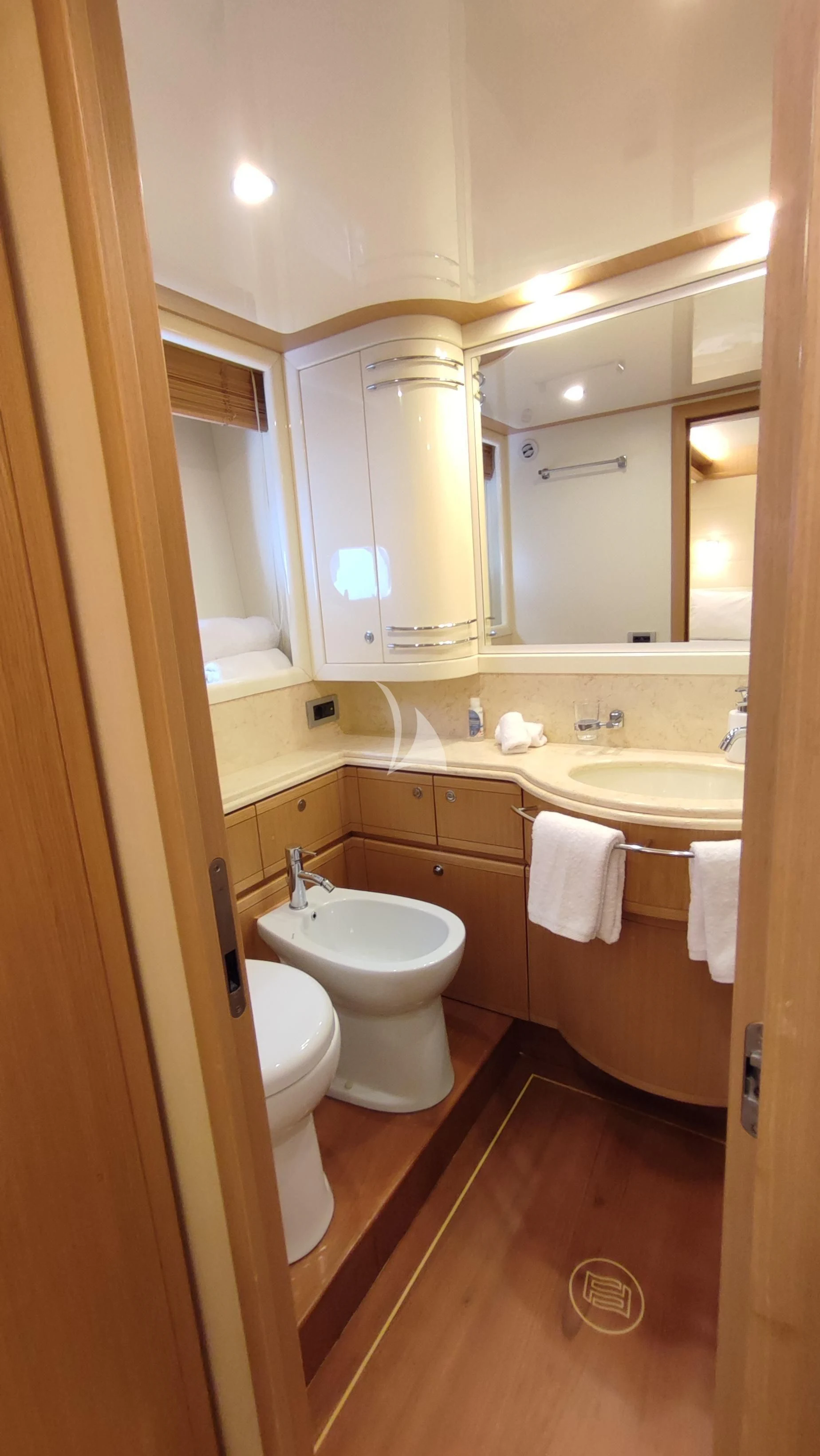 a bathroom with a mirror and a sink aboard MAYBE NOT Yacht for Sale
