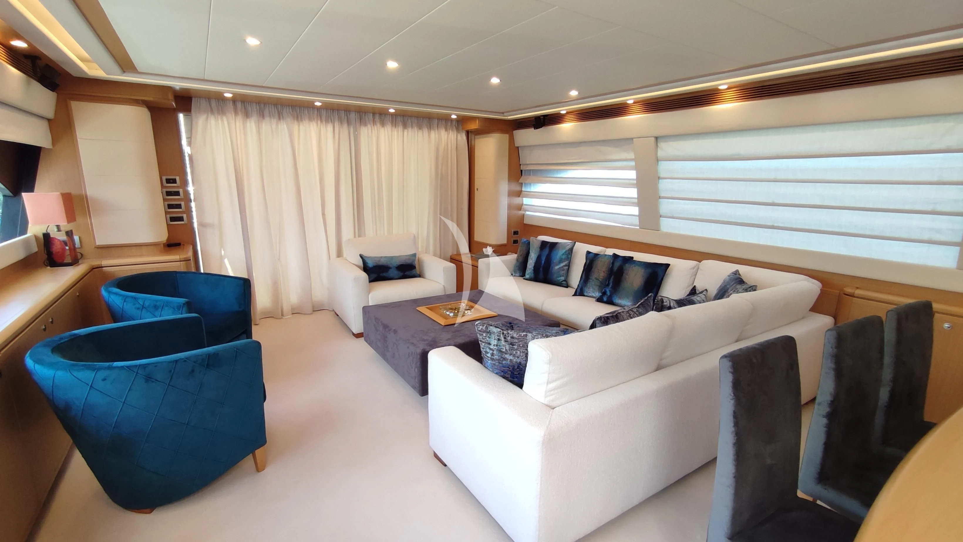 a living room with a couch and a table aboard MAYBE NOT Yacht for Sale