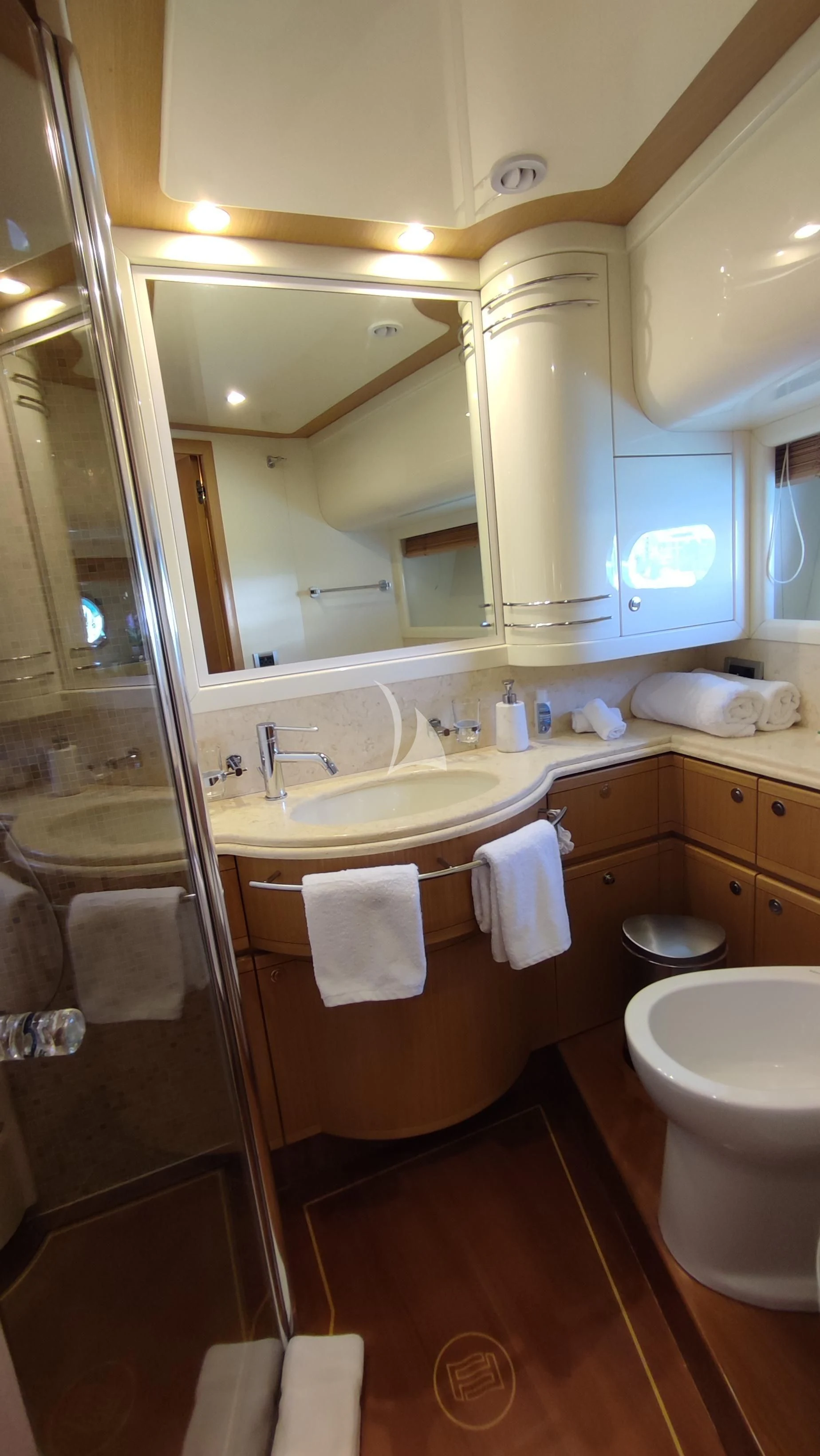 a bathroom with a large mirror aboard MAYBE NOT Yacht for Sale