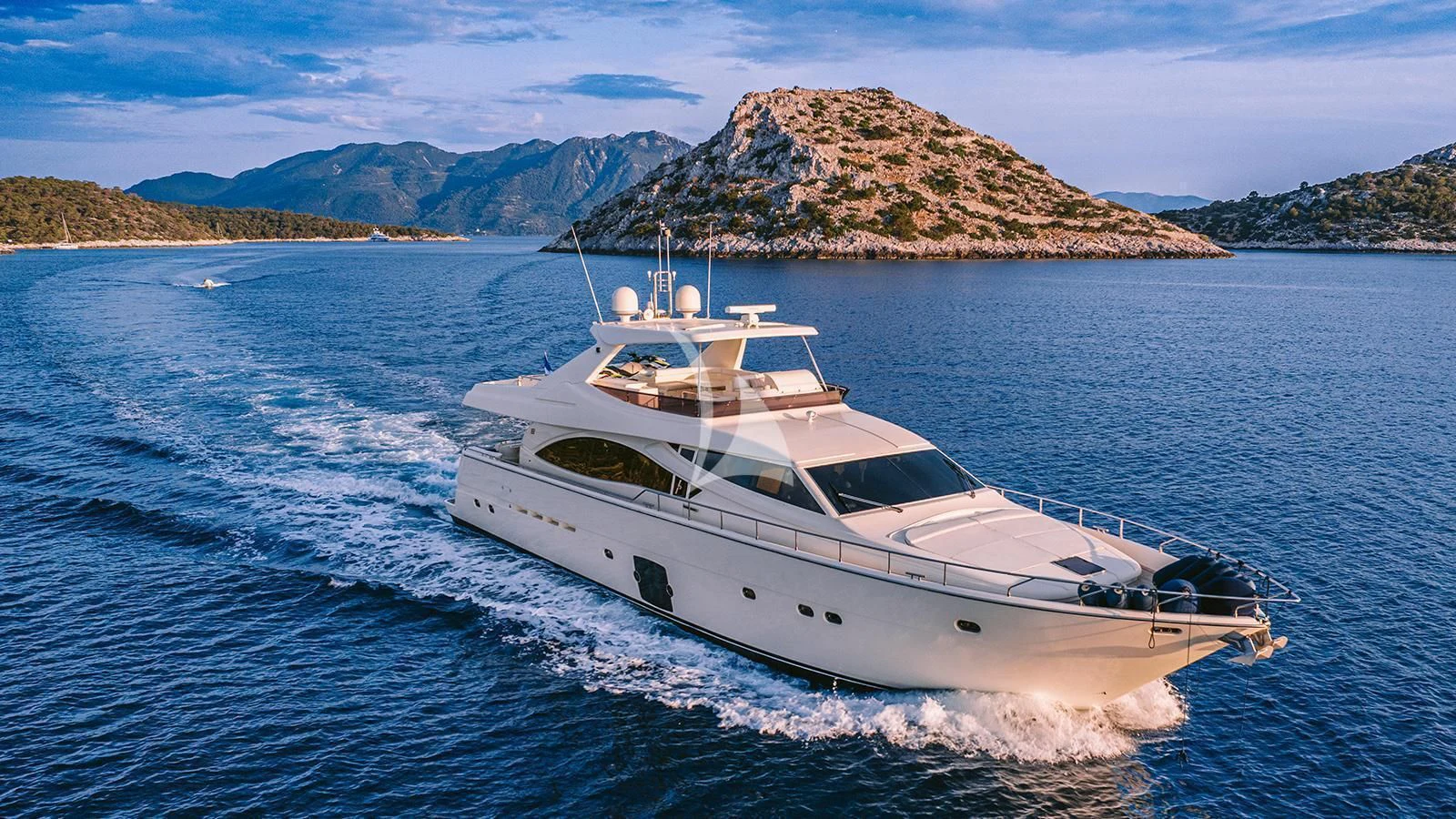 a white yacht on the water aboard MAYBE NOT Yacht for Sale