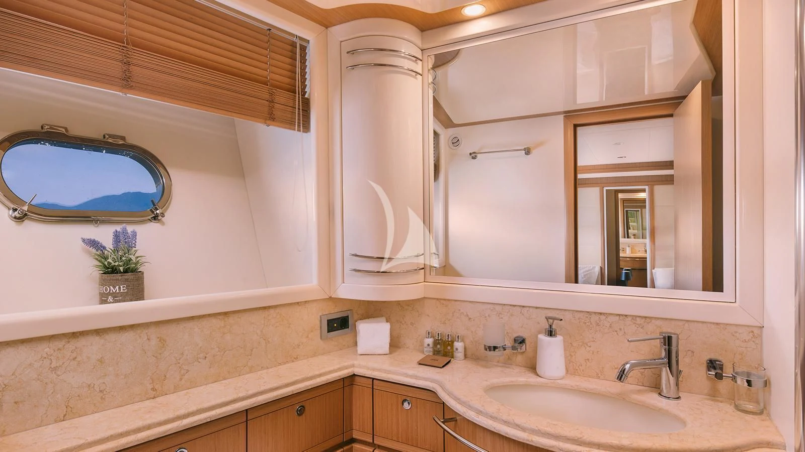 a bathroom with a large mirror aboard MAYBE NOT Yacht for Sale