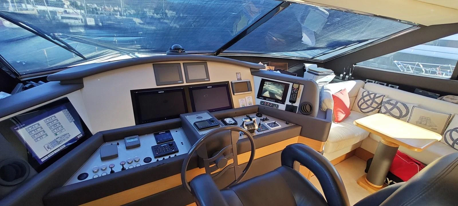 a group of computers on a table aboard MAYBE NOT Yacht for Sale