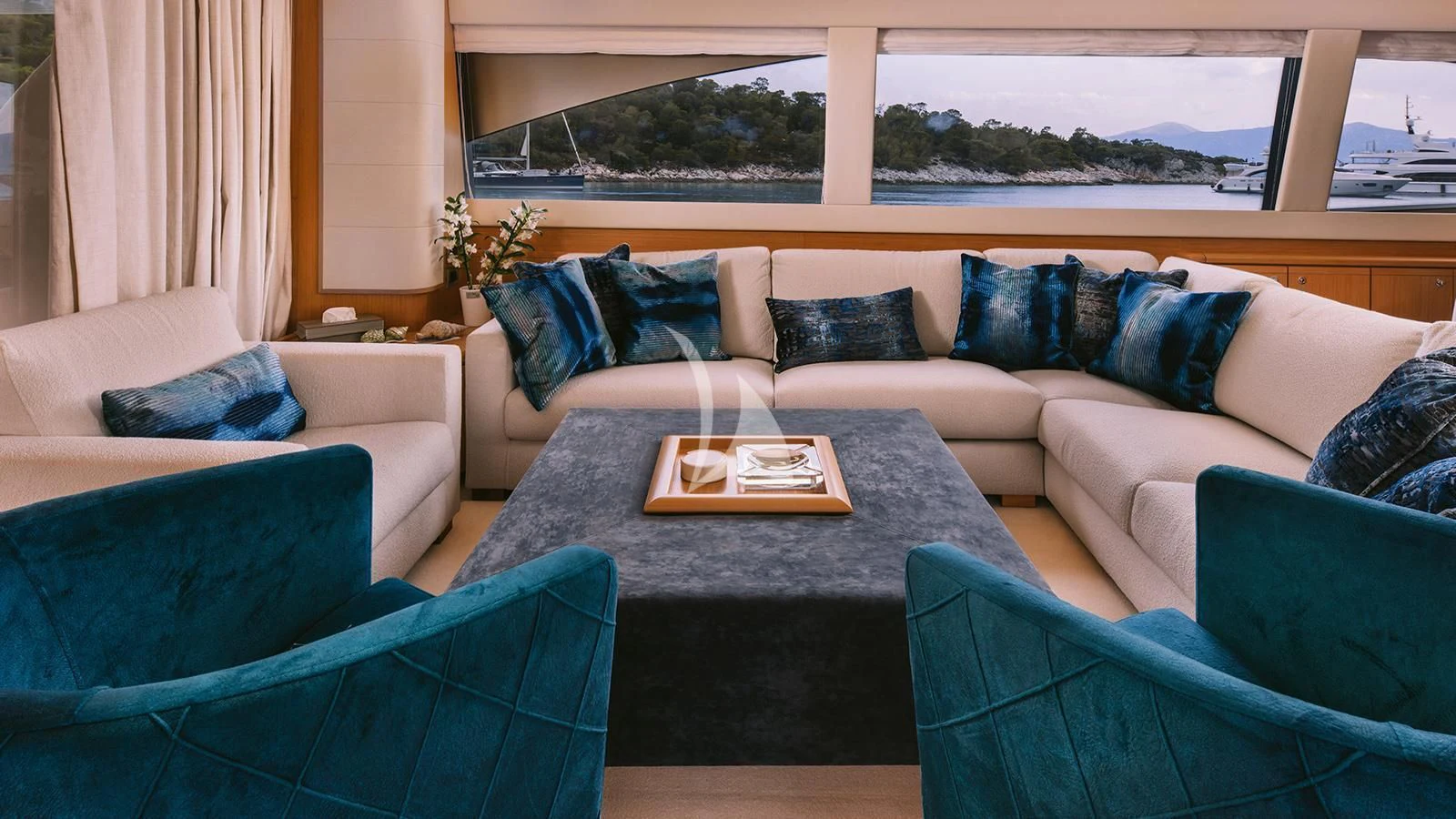 a living room with couches and a table aboard MAYBE NOT Yacht for Sale