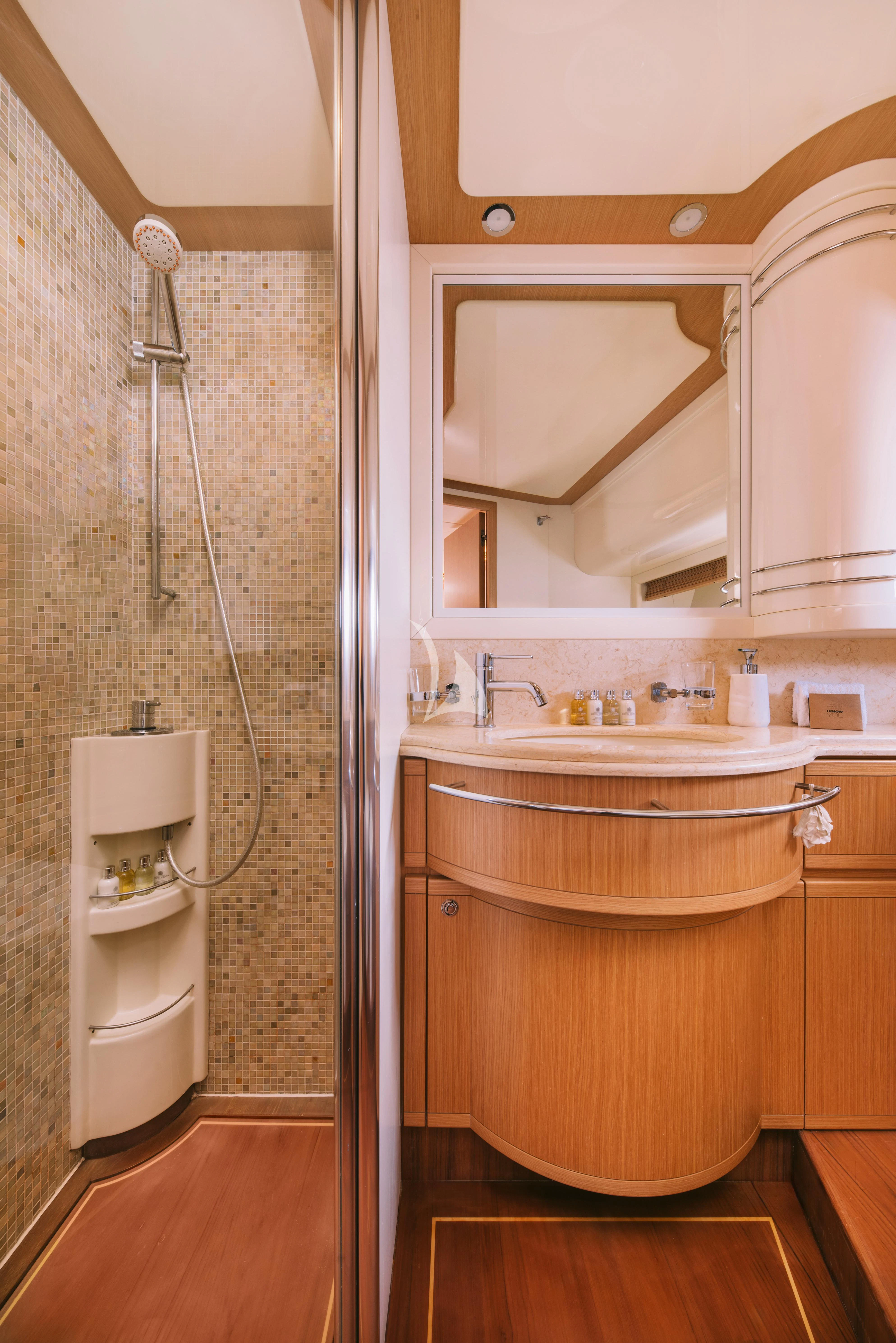a bathroom with a sink and a toilet aboard MAYBE NOT Yacht for Sale