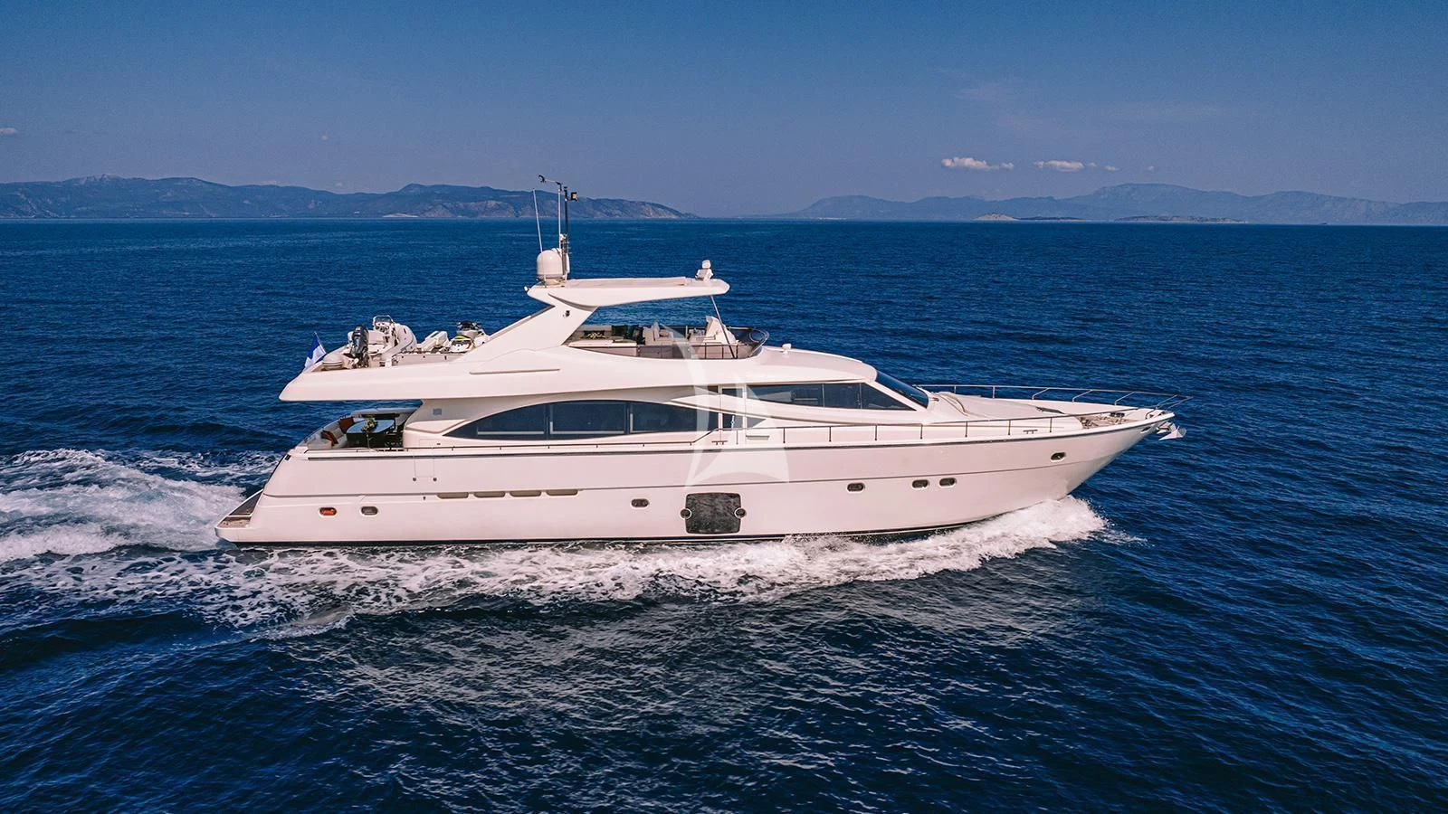 a white yacht on the water aboard MAYBE NOT Yacht for Sale