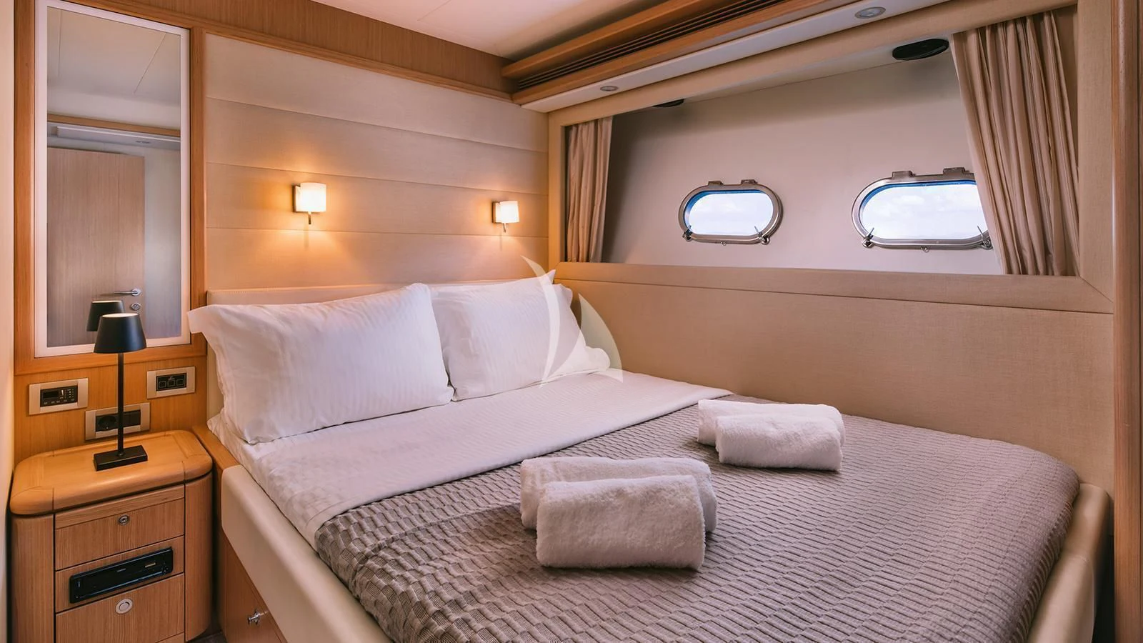 a bed with white sheets aboard MAYBE NOT Yacht for Sale