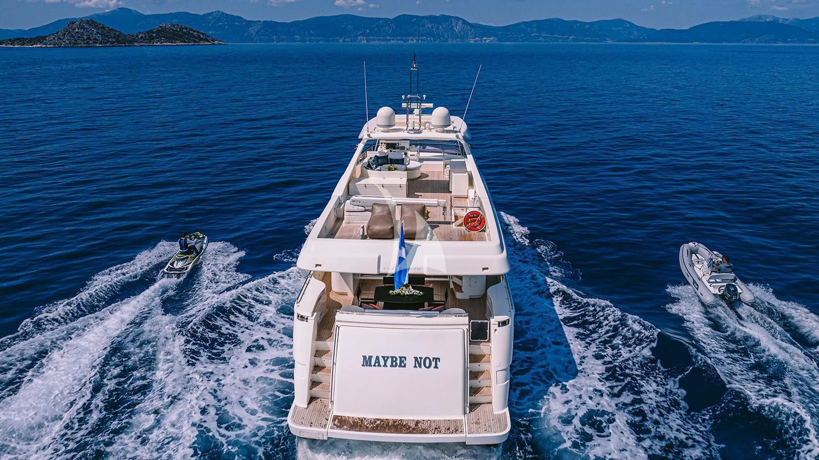 a boat on the water aboard MAYBE NOT Yacht for Sale