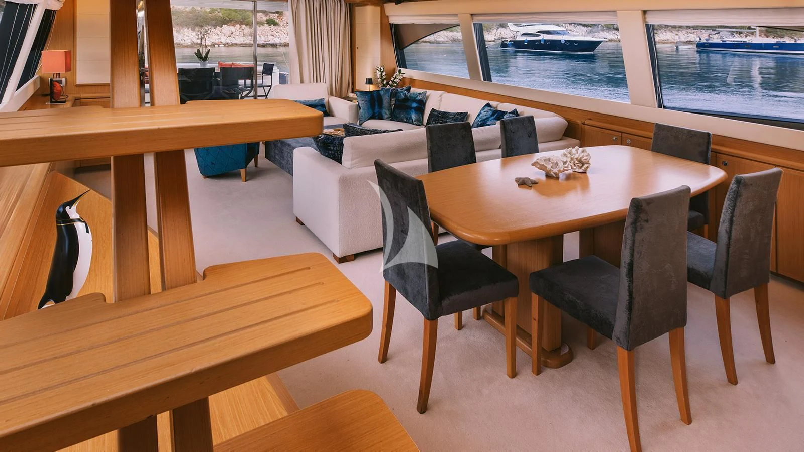 a table with chairs around it aboard MAYBE NOT Yacht for Sale