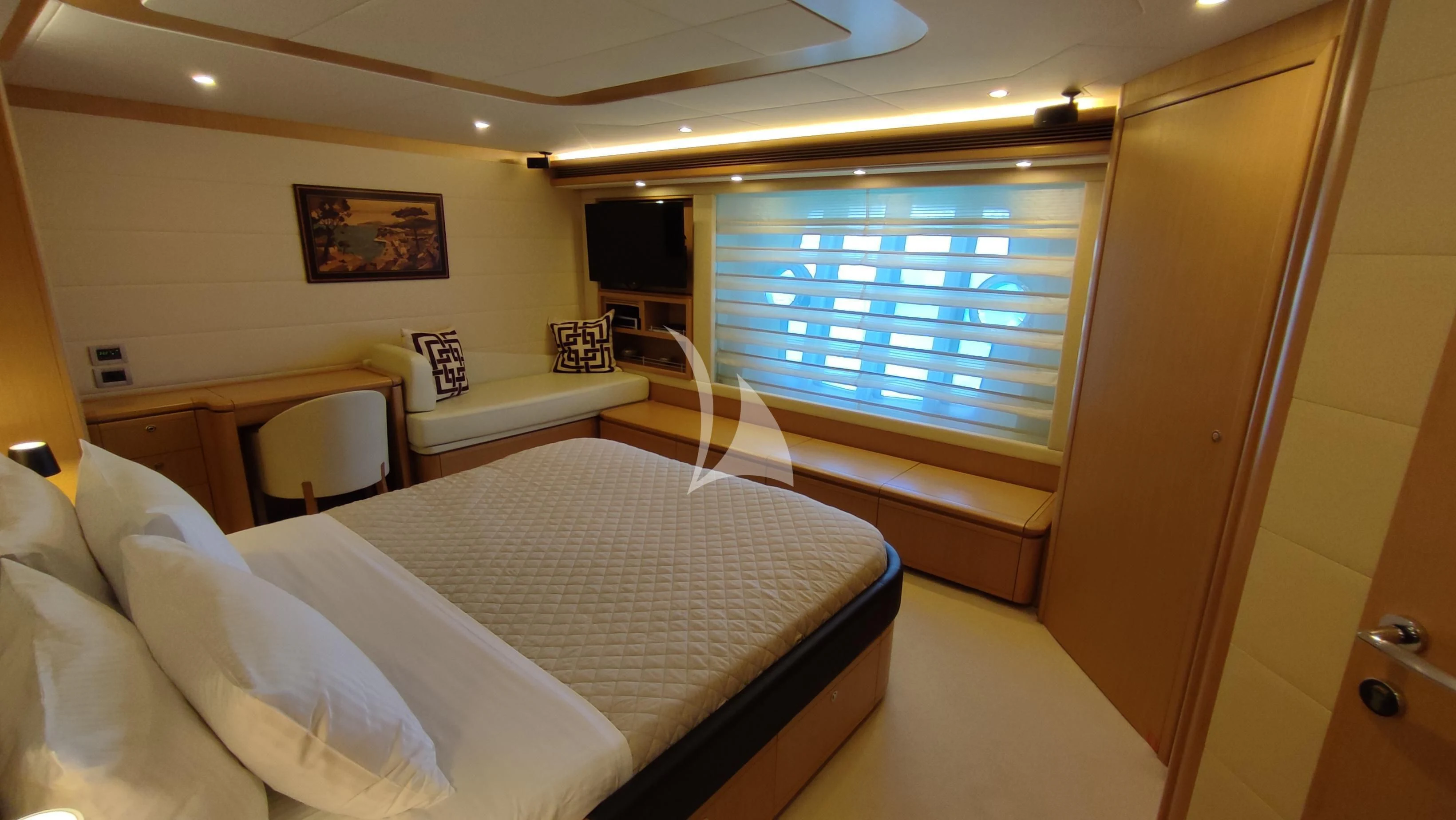 a room with a bed and a desk aboard MAYBE NOT Yacht for Sale