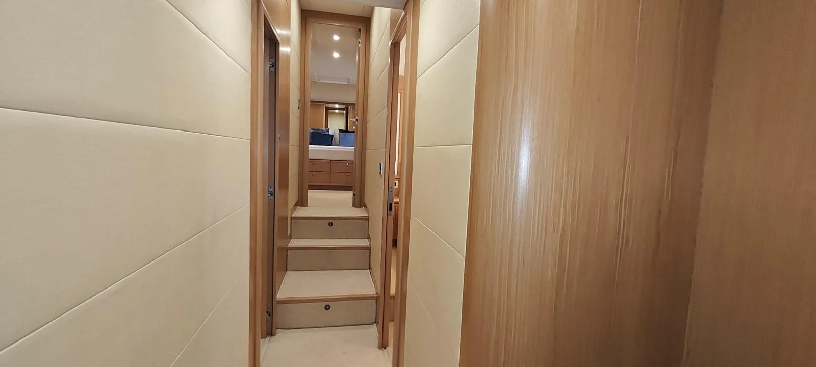 a hallway with a wood door and a wood door aboard MAYBE NOT Yacht for Sale