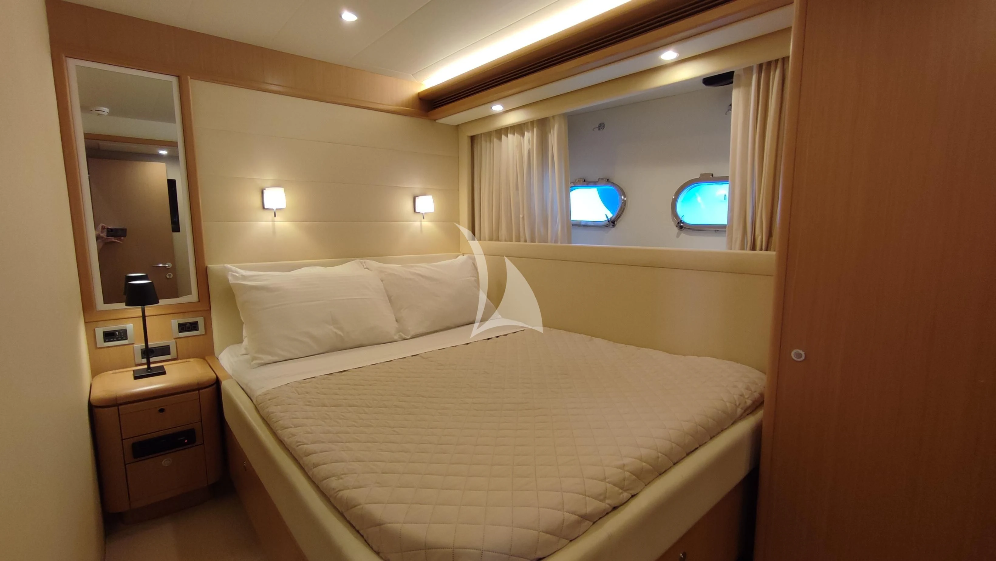 a bed with a white sheet aboard MAYBE NOT Yacht for Sale