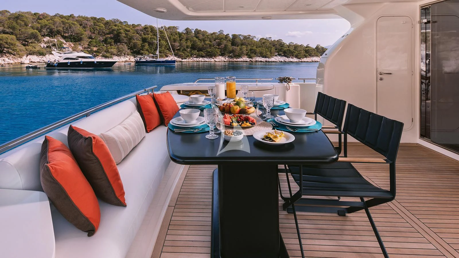 a table with food on it aboard MAYBE NOT Yacht for Sale
