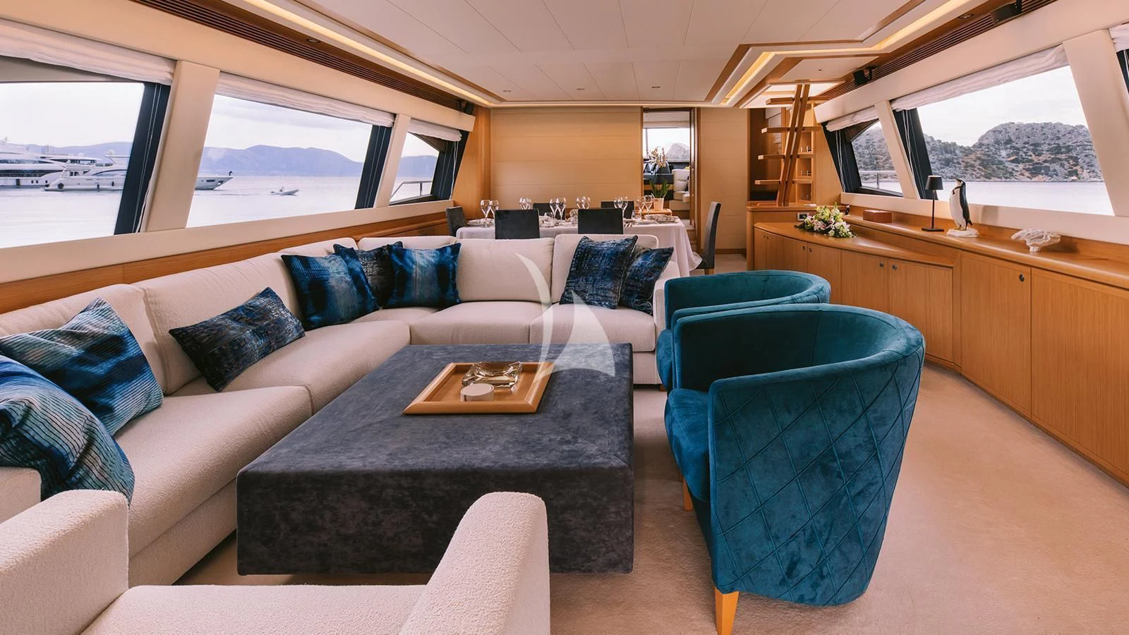 a living room with a couch and a table aboard MAYBE NOT Yacht for Sale