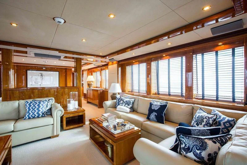 a living room with a couch and a coffee table aboard FRIVOLOUS Yacht for Sale
