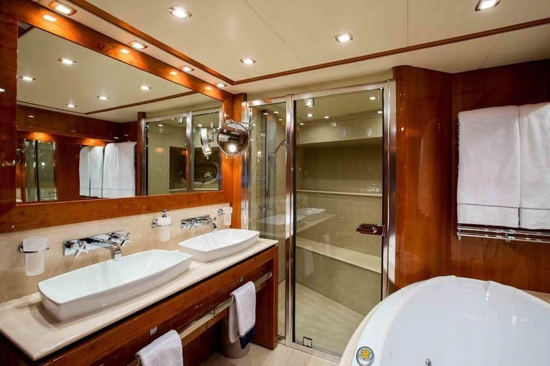 a bathroom with a large mirror aboard FRIVOLOUS Yacht for Sale