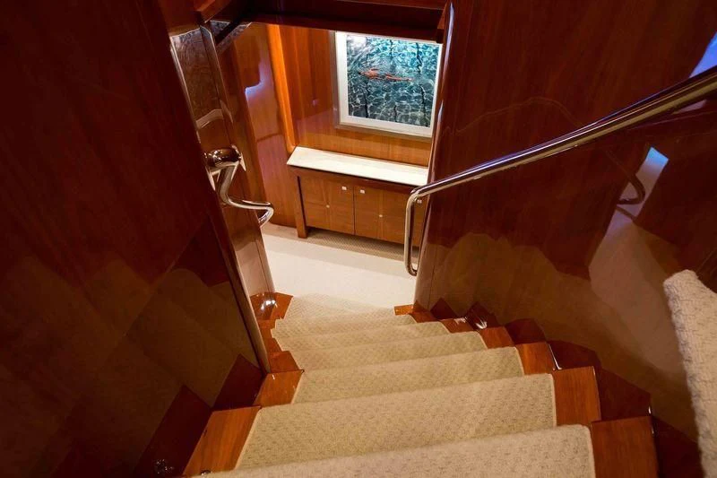 a staircase with a railing aboard FRIVOLOUS Yacht for Sale