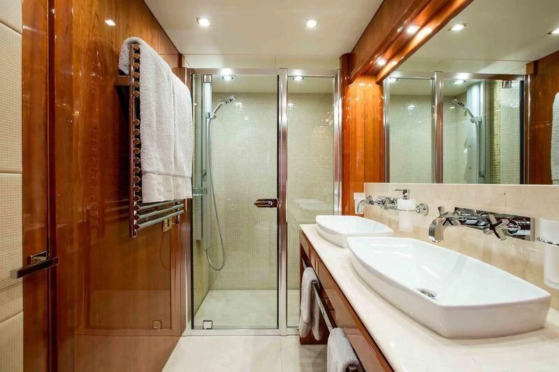 a bathroom with a large shower aboard FRIVOLOUS Yacht for Sale