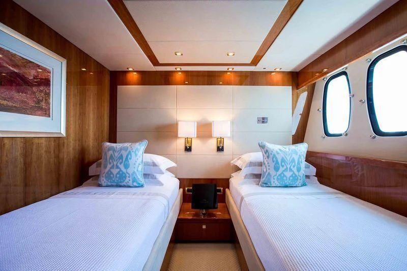 a couple of beds in a room aboard FRIVOLOUS Yacht for Sale