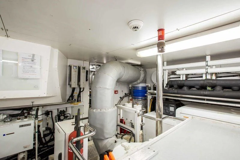 a room with machinery and pipes aboard FRIVOLOUS Yacht for Sale