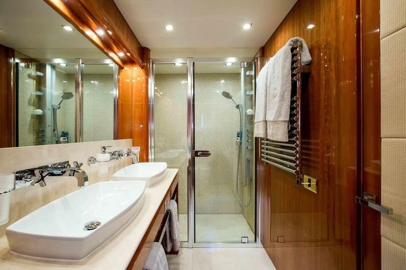 a bathroom with a sink and a shower aboard FRIVOLOUS Yacht for Sale