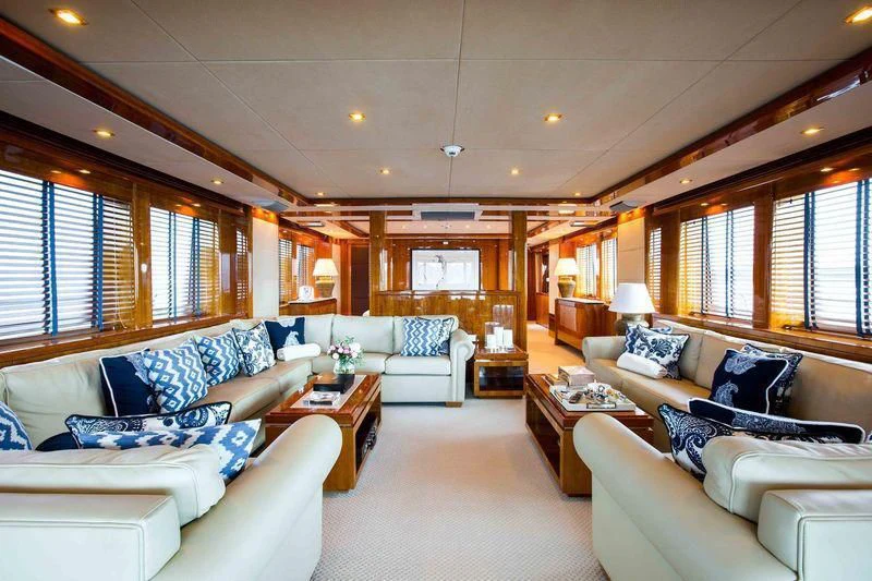 a living room with a couch and a coffee table aboard FRIVOLOUS Yacht for Sale