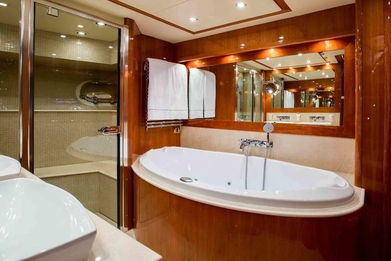 a bathroom with a large bathtub aboard FRIVOLOUS Yacht for Sale