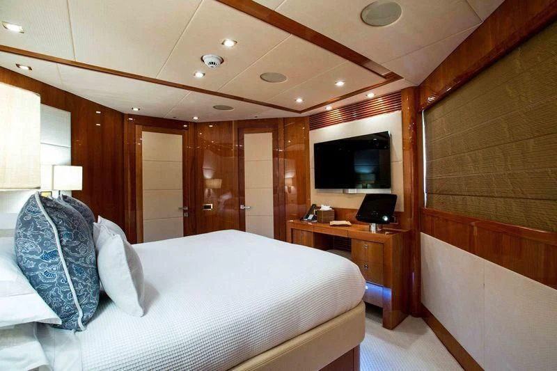 a hotel room with a bed aboard FRIVOLOUS Yacht for Sale
