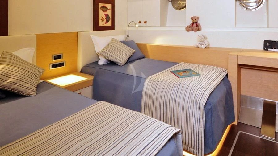 a couple of beds in a hotel room aboard TUYIKA S Yacht for Sale