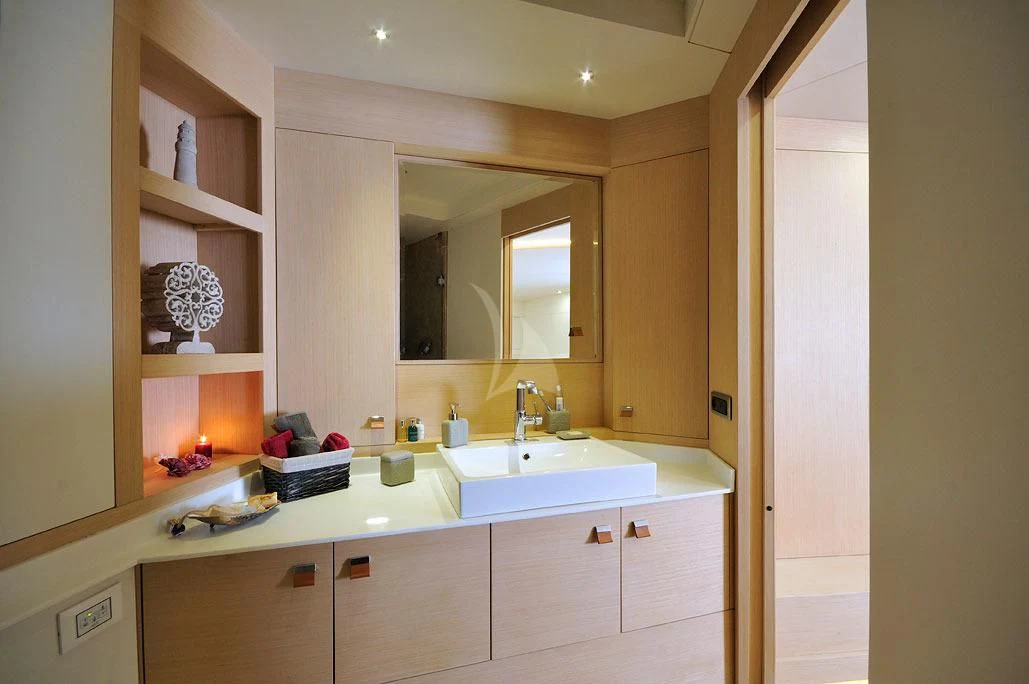a bathroom with a sink and cabinets aboard TUYIKA S Yacht for Sale